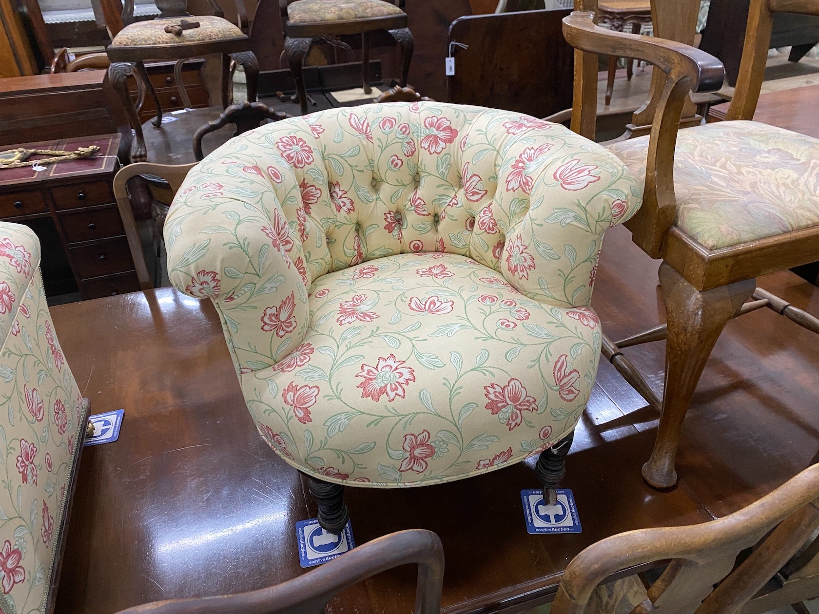 A Victorian upholstered ottoman, width 112cm, depth 59cm, height 50cm together with a Victorian tub chair in matching fabric